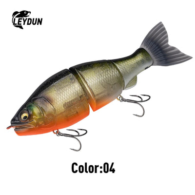 Green, orange, and white jointed swimbait lure with black fin and treble hooks