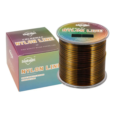 Gold/tan nylon fishing line spool with product box.