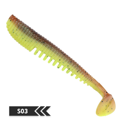 Soft fishing lure, chartreuse-brown translucent shad-style silicone bait, ribbed body, paddle tail