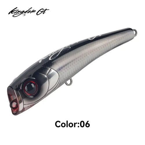 Kingdom GT popper lure, dark gray floating topwater with red-eyed detail and hook