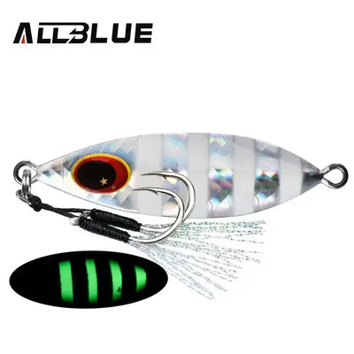 Silver metal slow jig with red oval eye, split rings, feathered treble hook, striped pattern