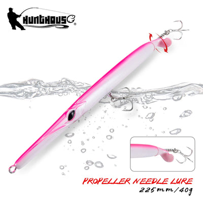 Propeller needle fishing lure, pink and white body with treble hooks and spinner tail