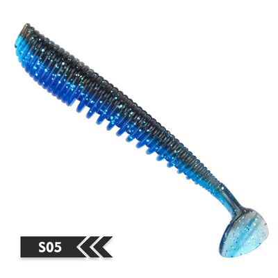 Soft fishing lure, blue-black translucent shad-style silicone bait, ribbed body, small tail