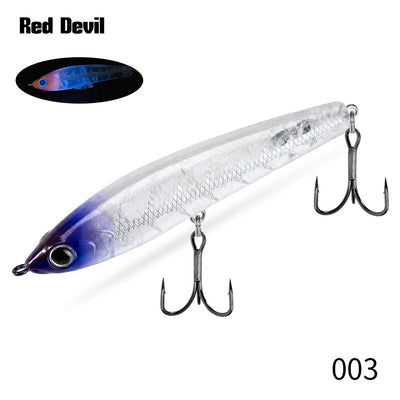 Topwater pencil fishing lure, clear white with blue-purple top and treble hooks.