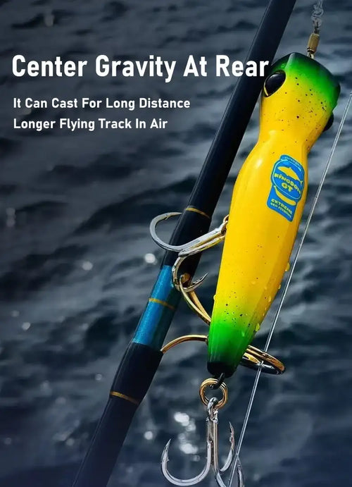 Yellow-green floating popper lure on line, deep cup mouth and black eye
