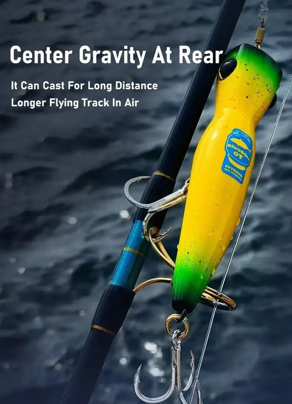 Yellow-green floating popper lure on line, deep cup mouth and black eye