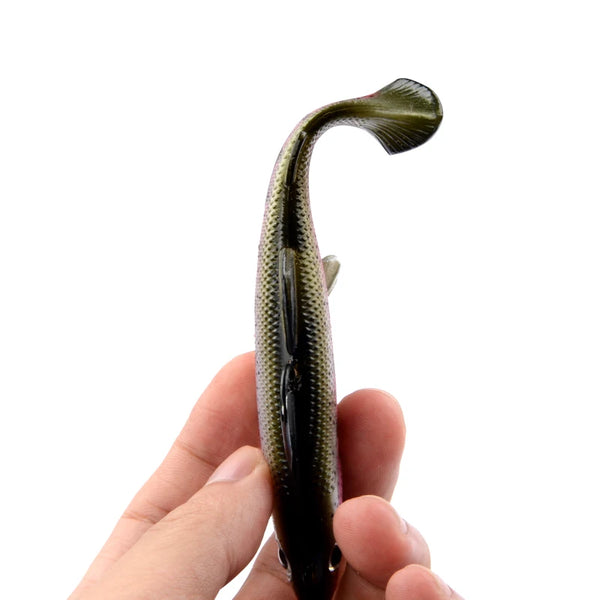 Weighted soft swimbait lure close-up in olive-green tone with T-tail and hook