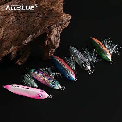 Metal jigging spoons lineup with colorful finishes, silver feather tails, and treble hooks.