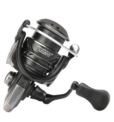 Spinning fishing reel close-up with silver spool, black handle grip, front view.
