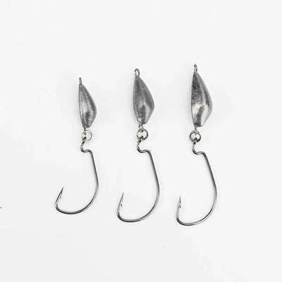 Weedless jig hooks with three silver lead heads and curved hooks