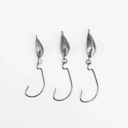 Weedless jig hooks with three silver lead heads and curved hooks