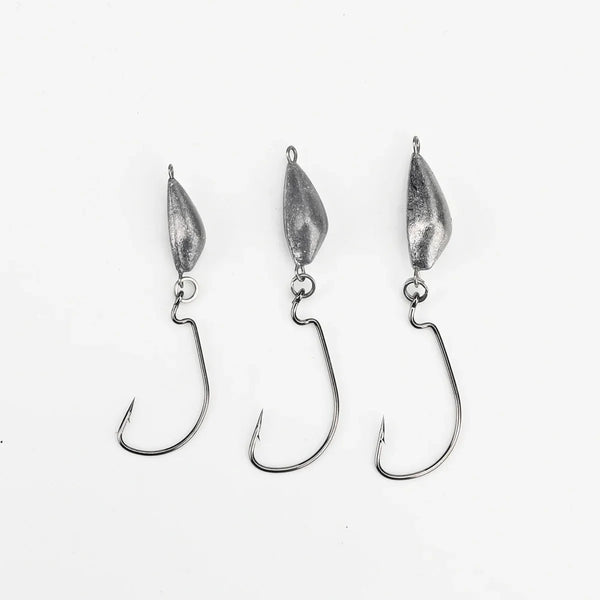 Weedless jig hooks with three silver lead heads and curved hooks