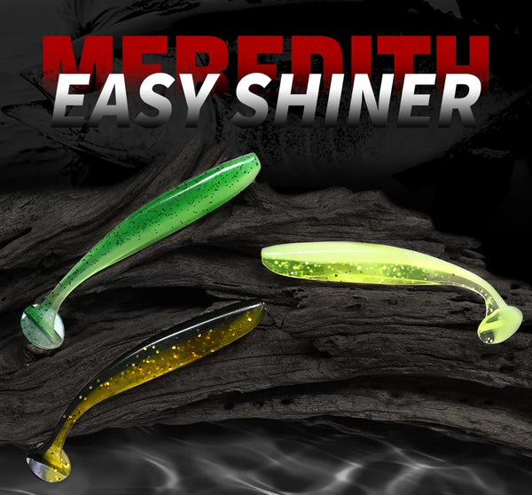 Green and yellow silicone T-tail fishing lures on dark background