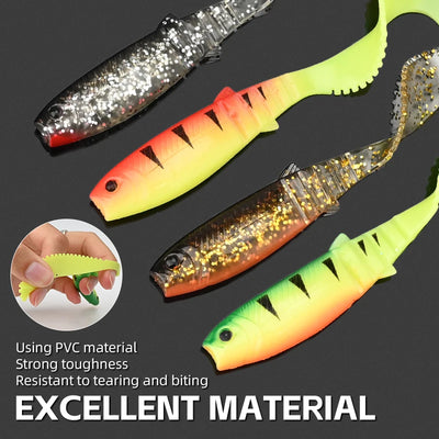 Assorted curly-tail soft swimbait lures in neon green, orange-yellow, and silver patterns.