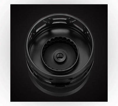 Black spinning fishing reel rotor with central star-shaped cap detail