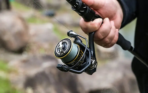 SeaKnight ARCHER2 spinning reel in black and gold with green CNC aluminium spool featuring fish alarm and 8+1 bearings