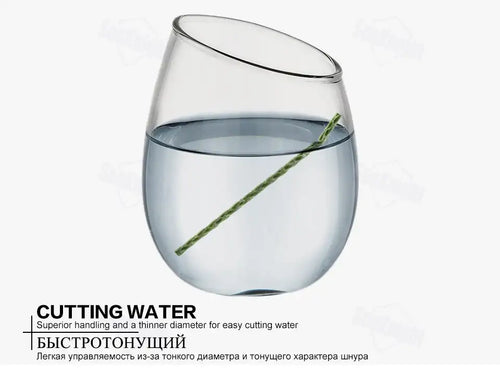 Green braided fishing line cutting through water in a glass bowl