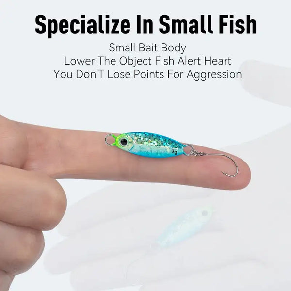 Micro metal jig fishing lure in hand, turquoise-blue glitter body with green eye single hook