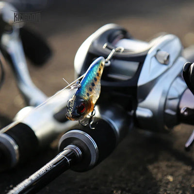 Blue-and-gold Kingdom VIB sinking hard bait lure with red eye and treble hook on line