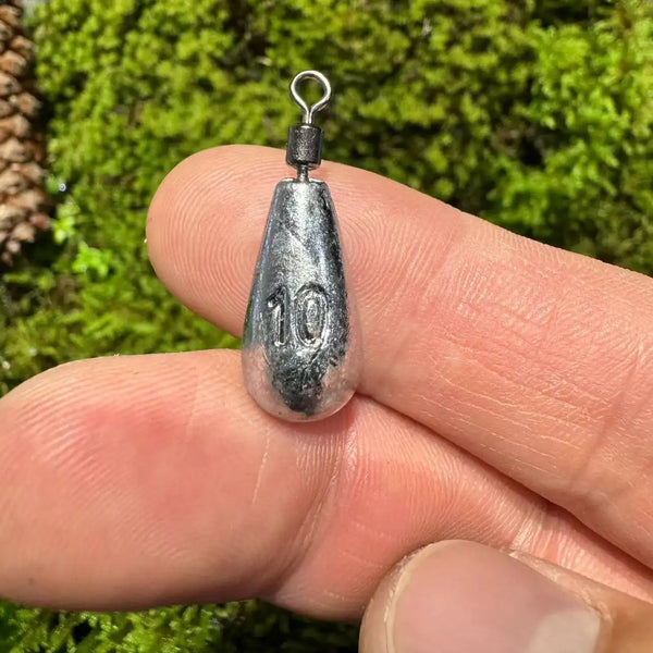 Metal 10g fishing sinker with swivel, close-up on hand
