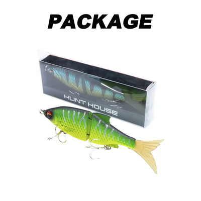 Hunthouse Flextail 135 jointed swimbait in box, green-and-yellow scales, treble hooks, feather tail