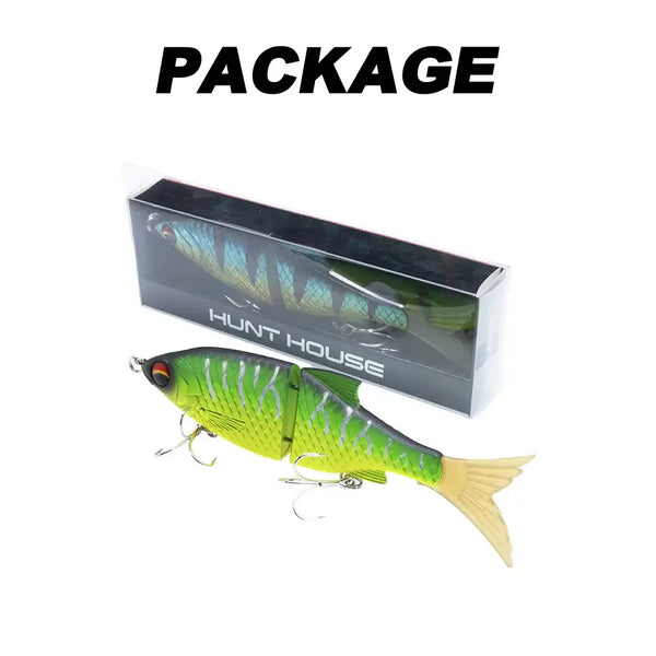 Hunthouse Flextail 135 jointed swimbait in box, green-and-yellow scales, treble hooks, feather tail