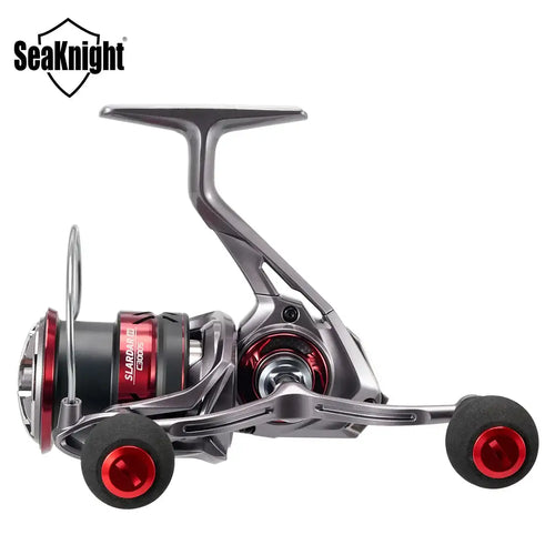 Close side view of spinning reel with gray frame, black grips, and red caps