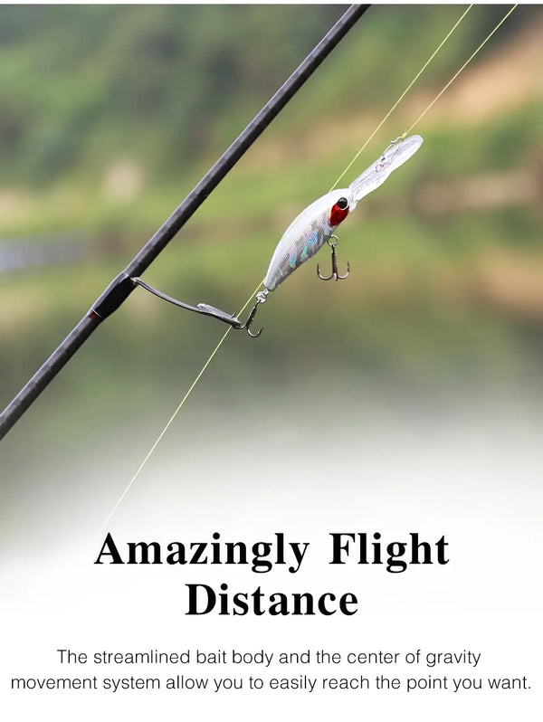 Suspending minnow hard body fishing lure, pale blue-silver body with red-tinted eye.