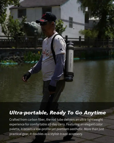 Angler carrying a portable fishing rod with rod tube while standing by water