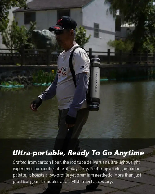Angler carrying a portable fishing rod with rod tube while standing by water