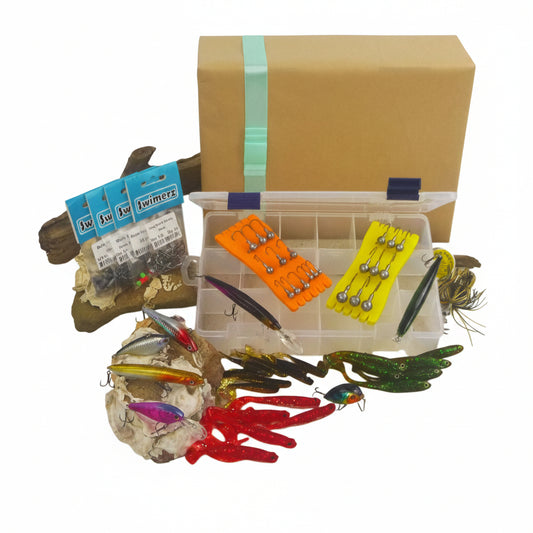 Fishing tackle gift set with clear compartment box and colorful lures, hooks, and weights