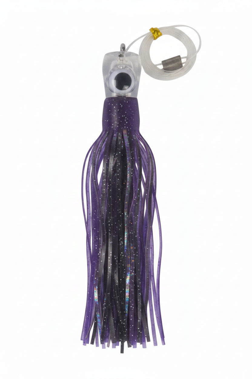 Tuna trolling lure rig with glittery purple skirt and clear head, with hanging loop