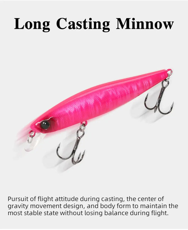 Suspending minnow jerkbait lure in bright pink with black eye and dual treble hooks