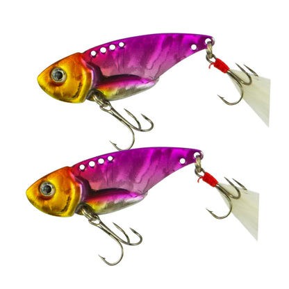 Fishing lure set in magenta and gold with feather-style tail, double treble hooks