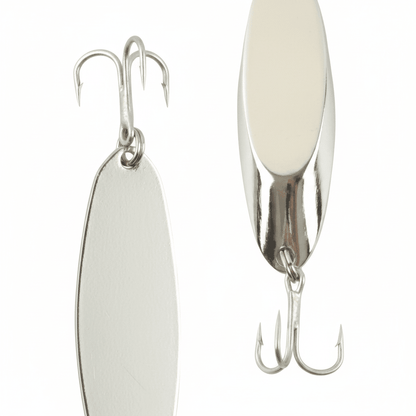 Pair of oval fishing jigs with pale bodies, chrome sides, and twin treble hooks.
