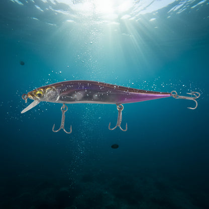 Floating minnow hard body lure in purple and gray side view with two treble hooks