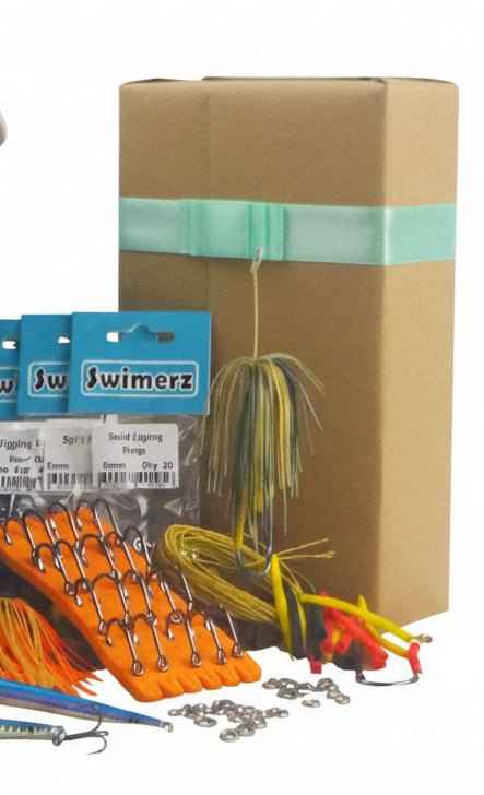 Fishing jig gift pack: box with orange/yellow metal jigs and spinner lures