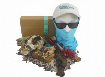Fishing tackle gift box with blue head covering and dark lures and hooks