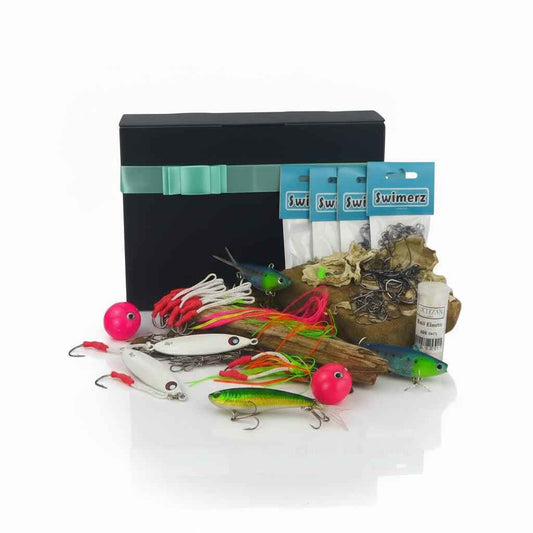 Jigging tackle gift set with assorted lures and hooks in a storage box