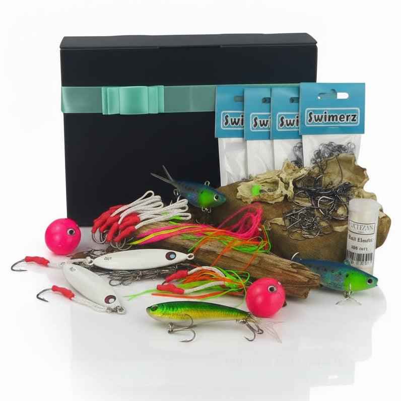 Jigging tackle gift set with assorted lures, hooks, and bait packs in a box