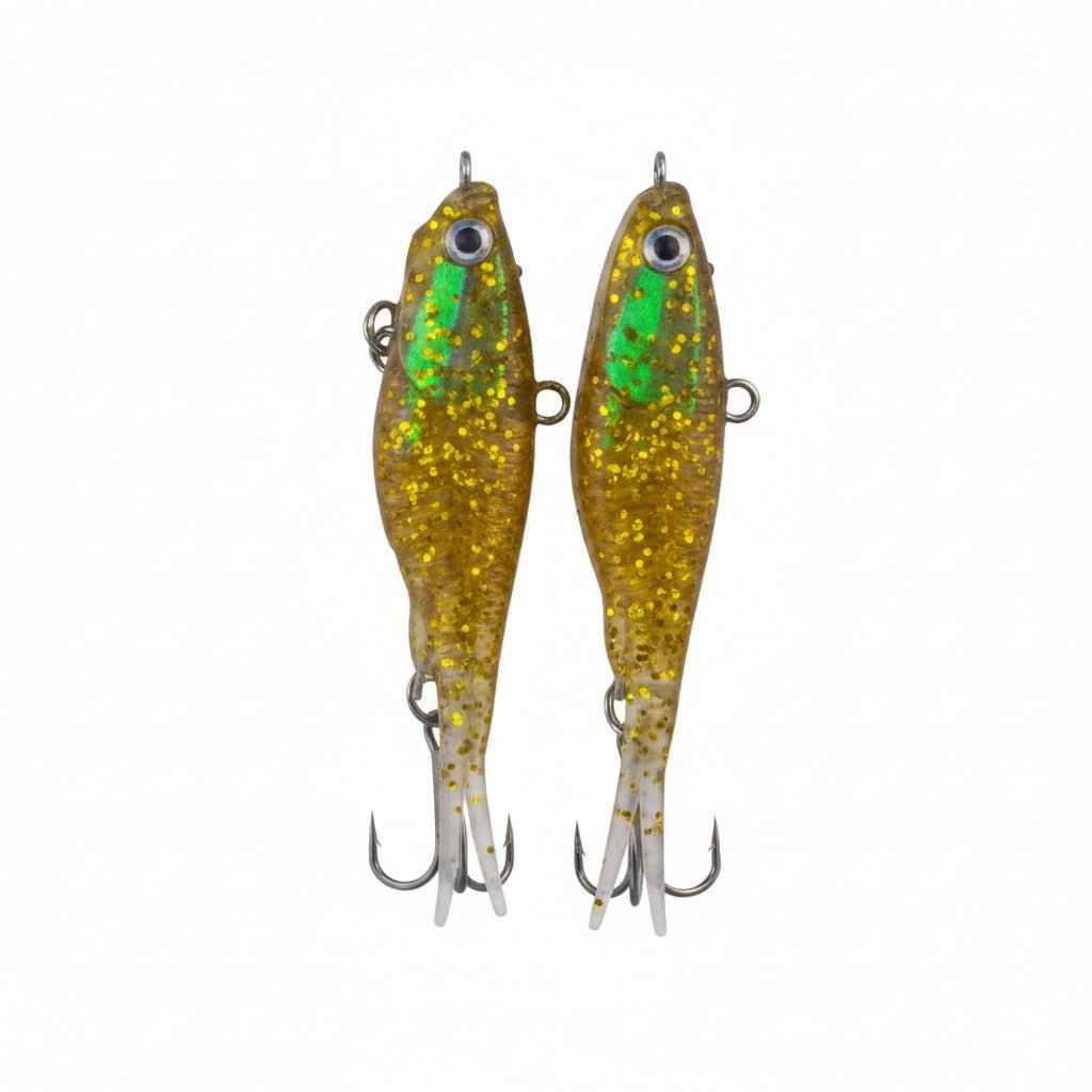 Two gold glitter soft plastic lures with green accents, eyelets, and treble hooks