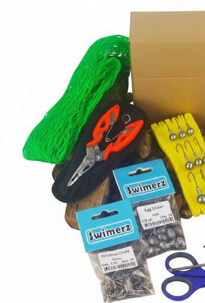 Fishing tackle gift set with green net, lure cards, scissors and packaged bait