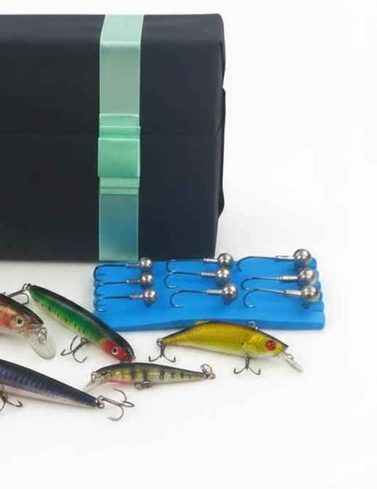 Fishing lure gift set tray with metal-tipped lures and treble hooks, blue holder