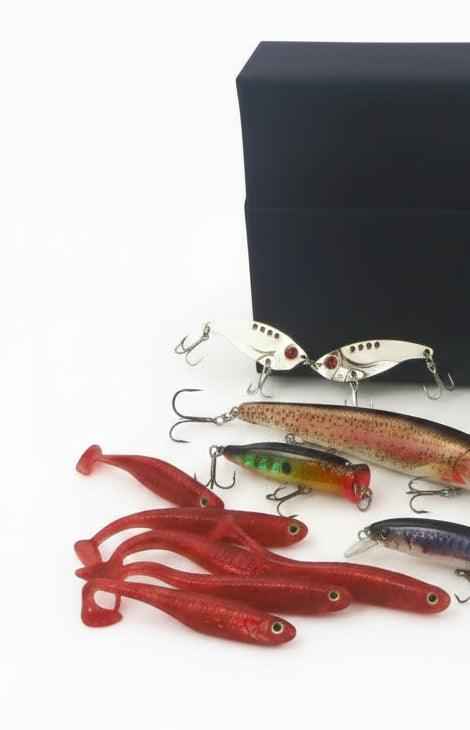 Fishing lure gift set with white and red topwater lures and silver crankbait